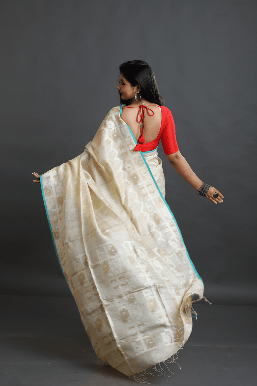 Beige with firoza border traditional handwoven jamdani saree in tusser silk - Tamal Boutique