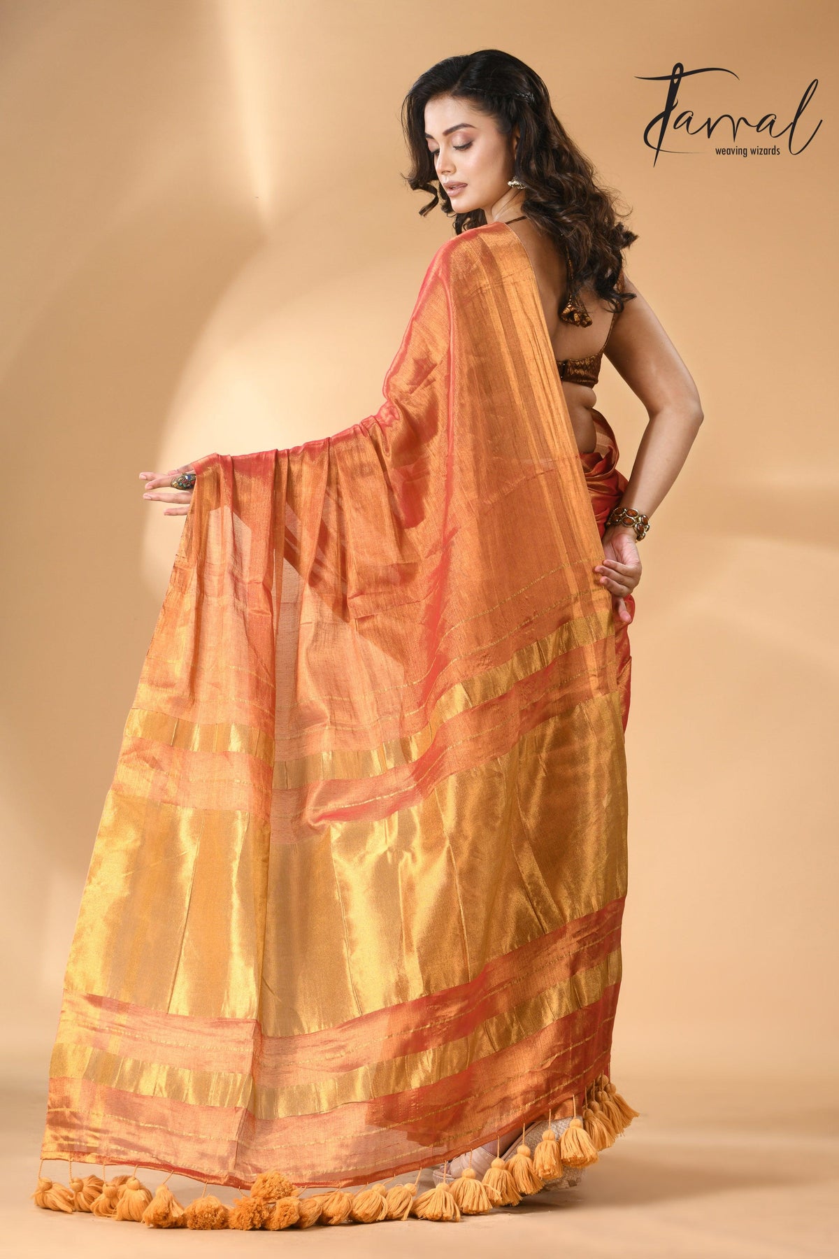 Golden orange tissue handloom saree back