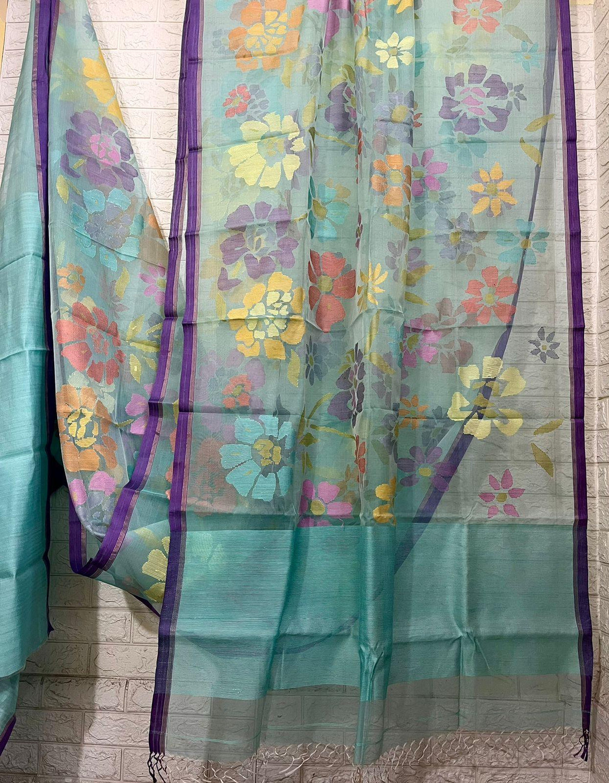 Turquoise blue with allover seasonal floral motifs handwoven muslin silk jamdani saree - Tamal Boutique