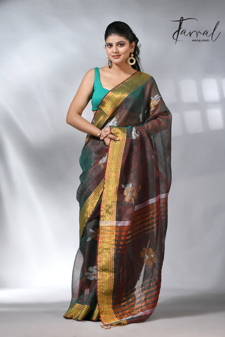 With this beautiful Pine green linen handloom jamdani saree