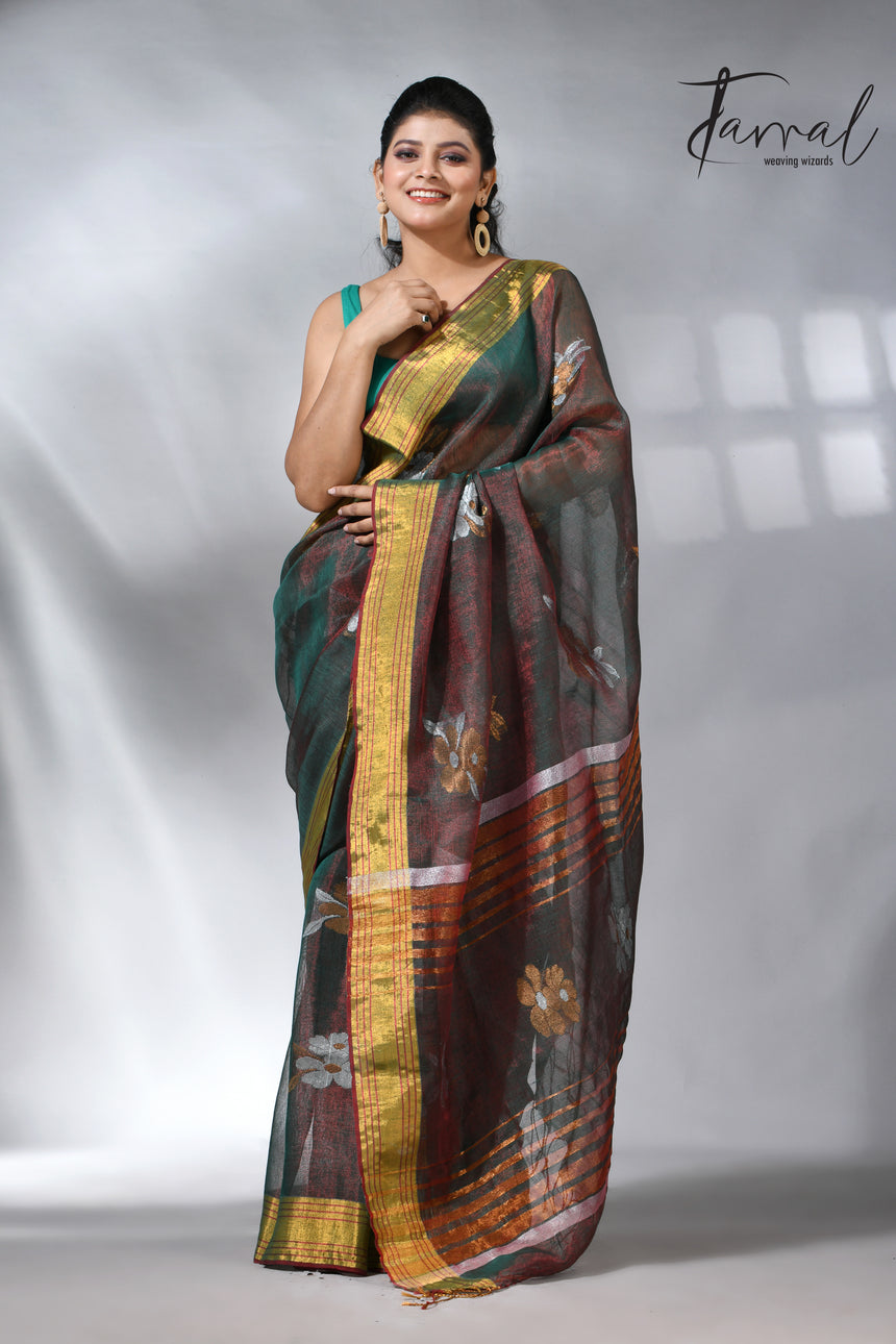 With this beautiful Pine green linen handloom jamdani saree