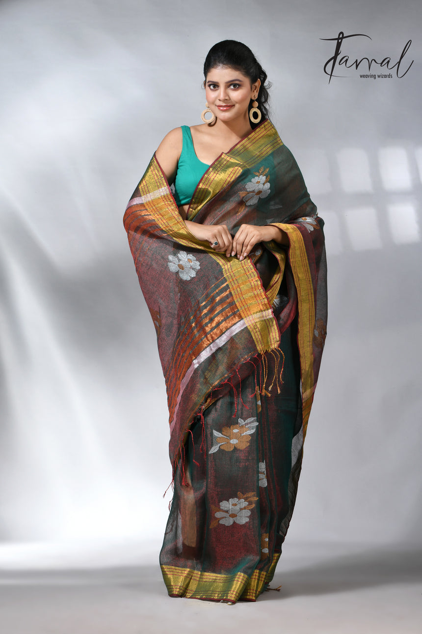 With this beautiful Pine green linen handloom jamdani saree