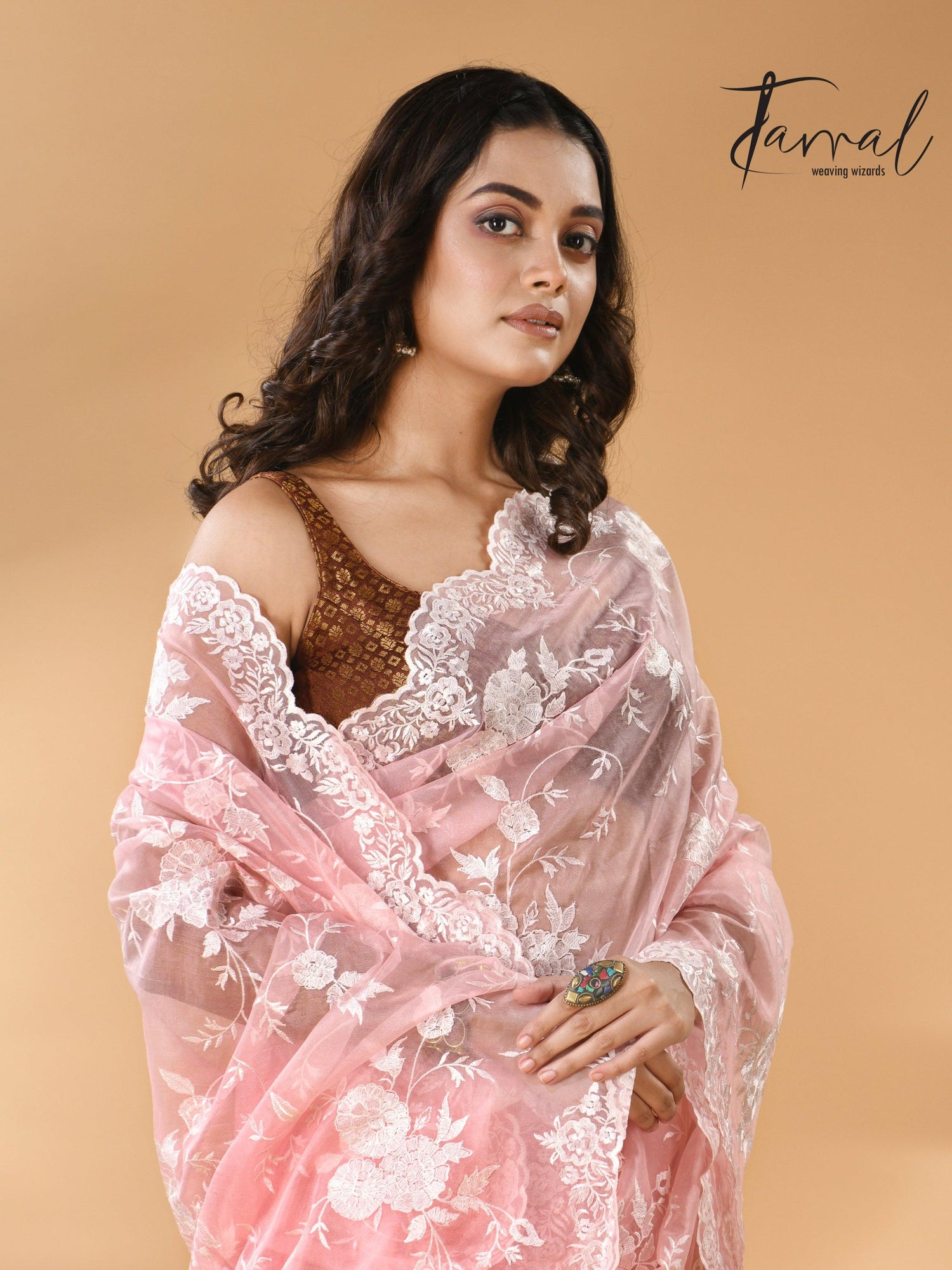 Baby pink organza embroidered handloom saree closeup