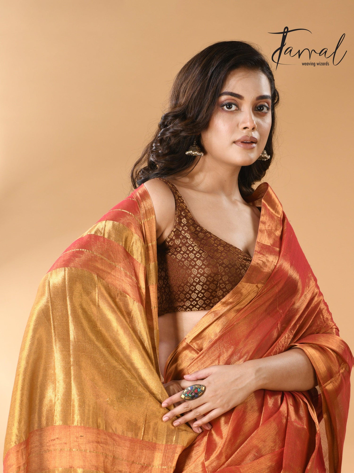 Golden orange tissue handloom saree closeu