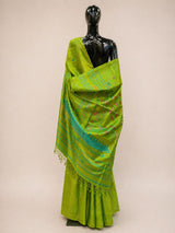 Green saree with a mannequin on a beige background