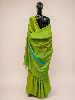Green saree with a mannequin on a beige background