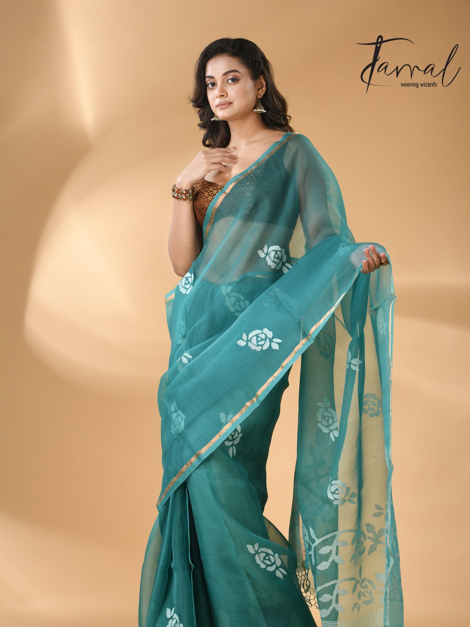 Handwoven needle work  muslin silk jamdani saree with teal blue motifs left