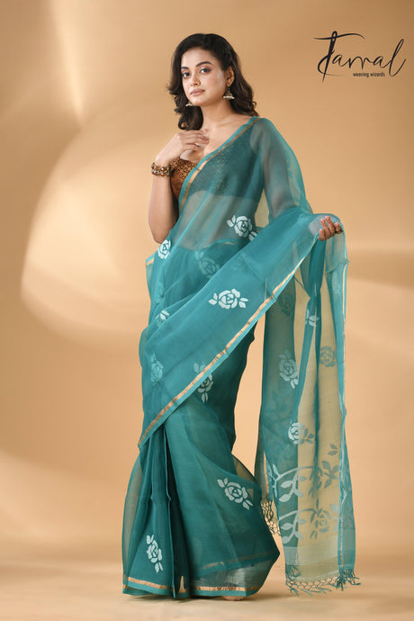 Handwoven needle work  muslin silk jamdani saree with teal blue motifs left