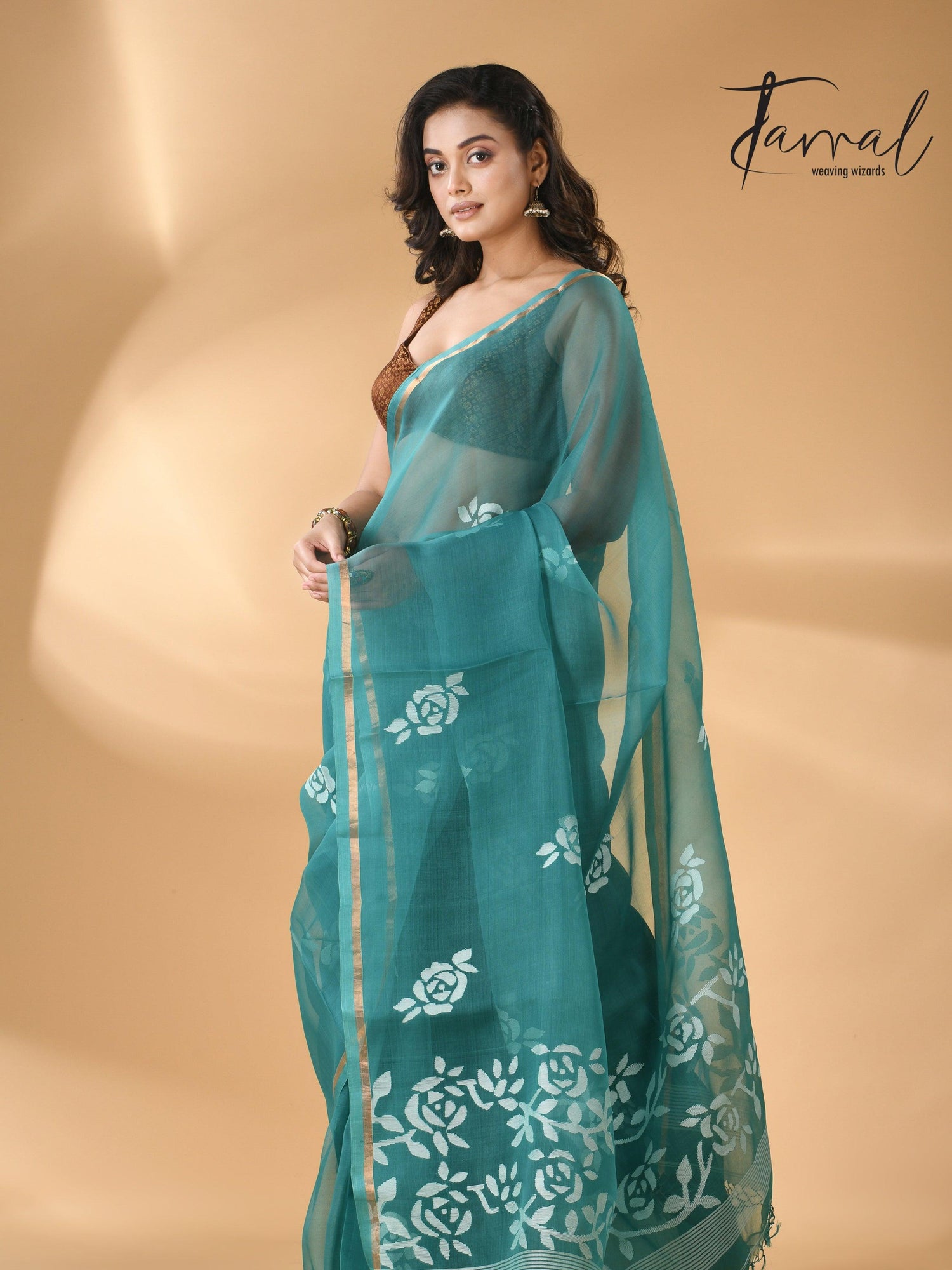 Handwoven needle work  muslin silk jamdani saree with teal blue motifs left 1