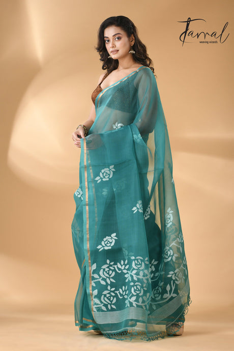 Handwoven needle work  muslin silk jamdani saree with teal blue motifs left 1