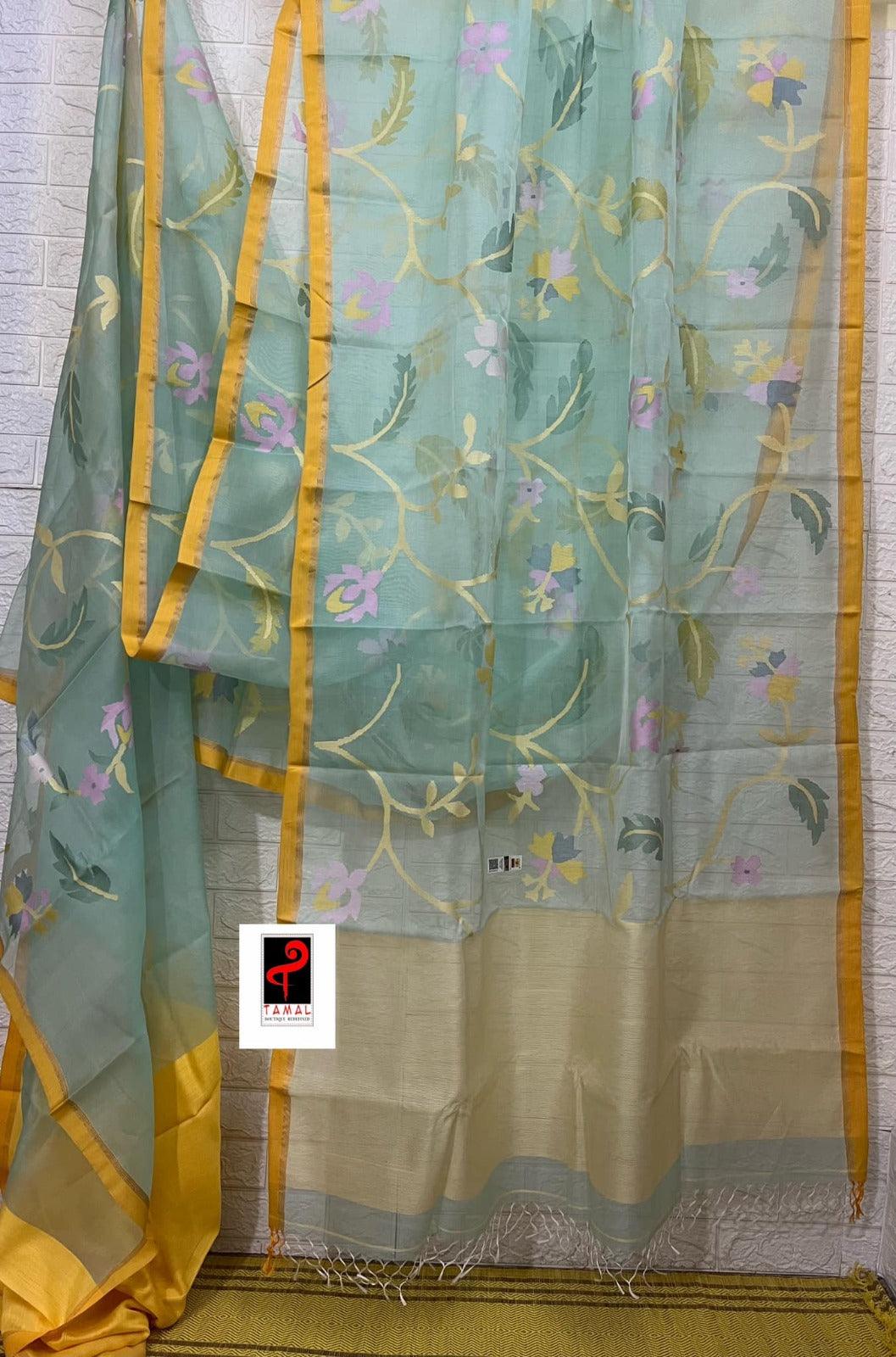 Light Firoza with yellow border allover hibiscus & other floral motifs handwoven jamdani saree in muslin silk - Tamal Boutique