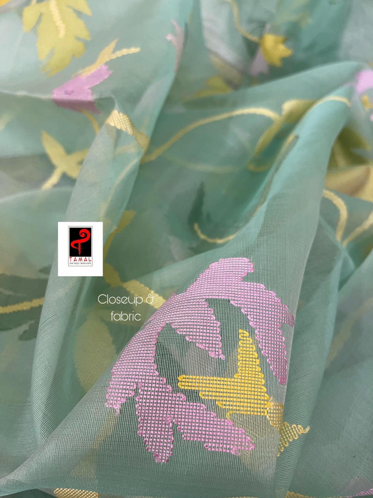 Light Firoza with yellow border allover hibiscus & other floral motifs handwoven jamdani saree in muslin silk - Tamal Boutique