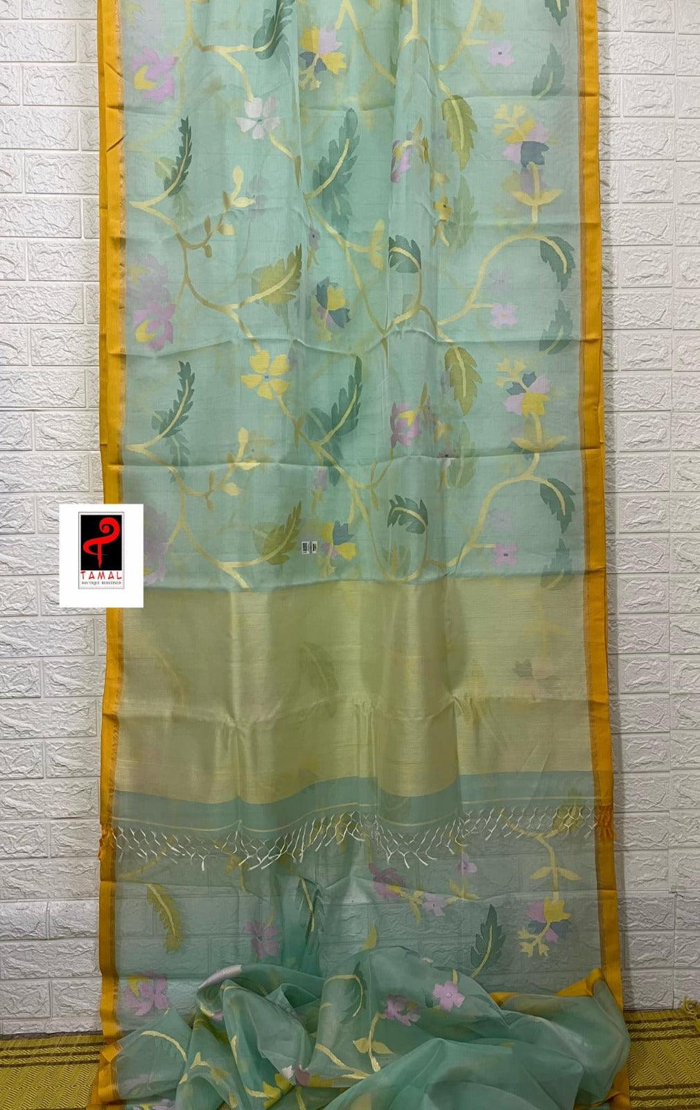 Light Firoza with yellow border allover hibiscus & other floral motifs handwoven jamdani saree in muslin silk - Tamal Boutique