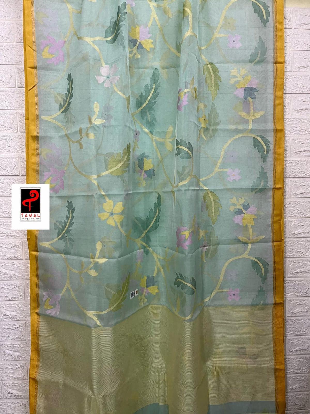 Light Firoza with yellow border allover hibiscus & other floral motifs handwoven jamdani saree in muslin silk - Tamal Boutique