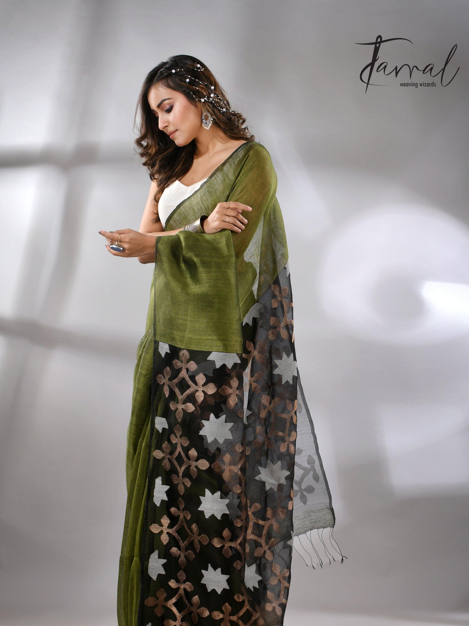 Linen handwoven jamdani saree in green and black star pallu5