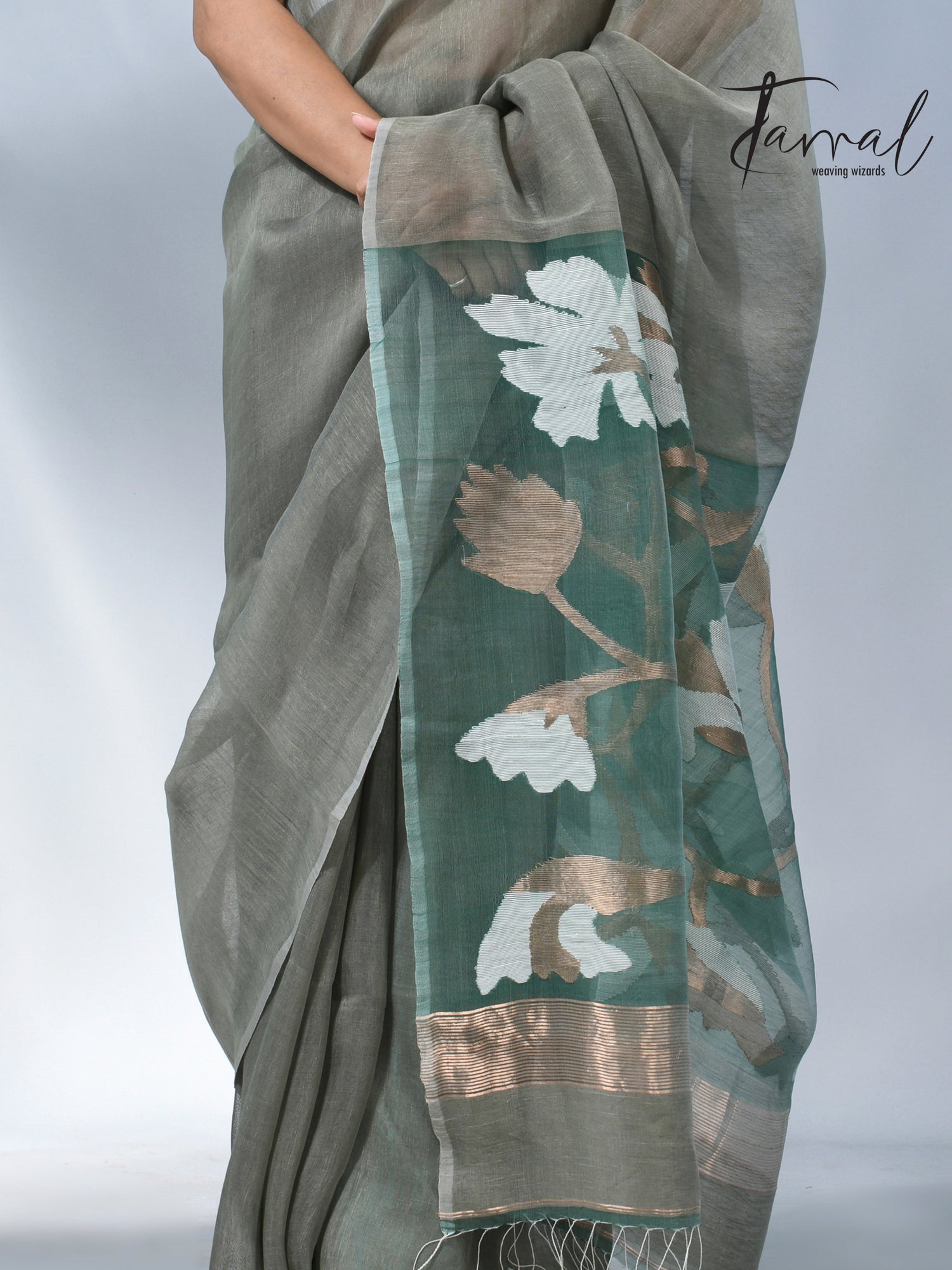 Moss green floral pallu silk linen handwoven jamdani saree