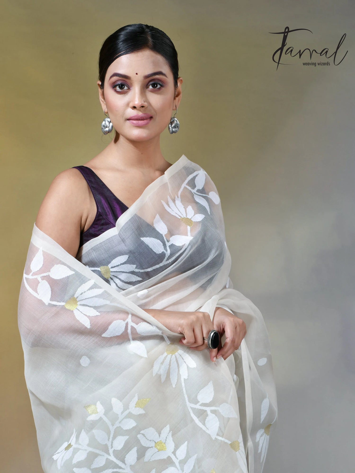 Off white self floral in handwoven muslin silk jamdani saree