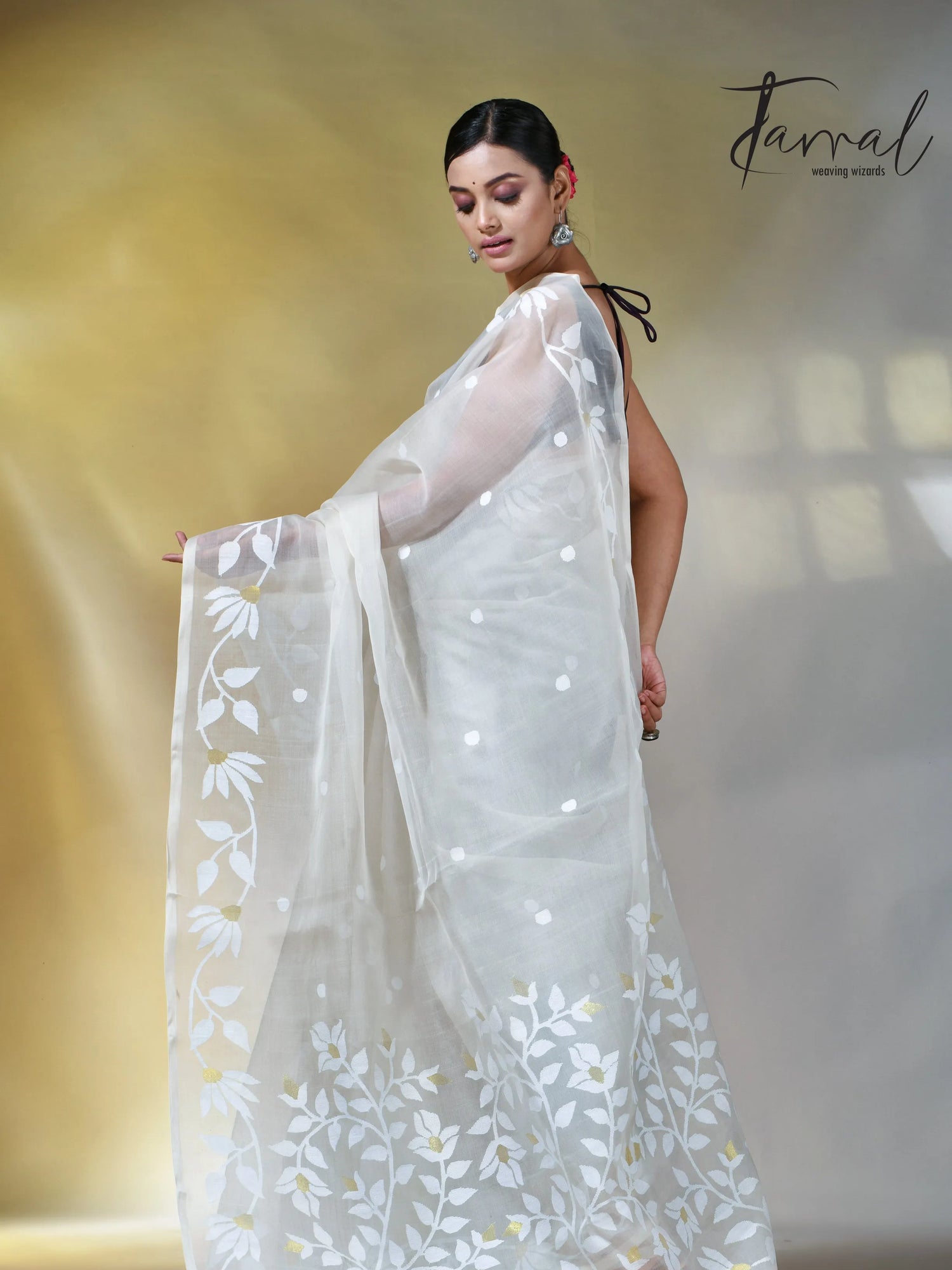 Off white self floral in handwoven muslin silk jamdani saree