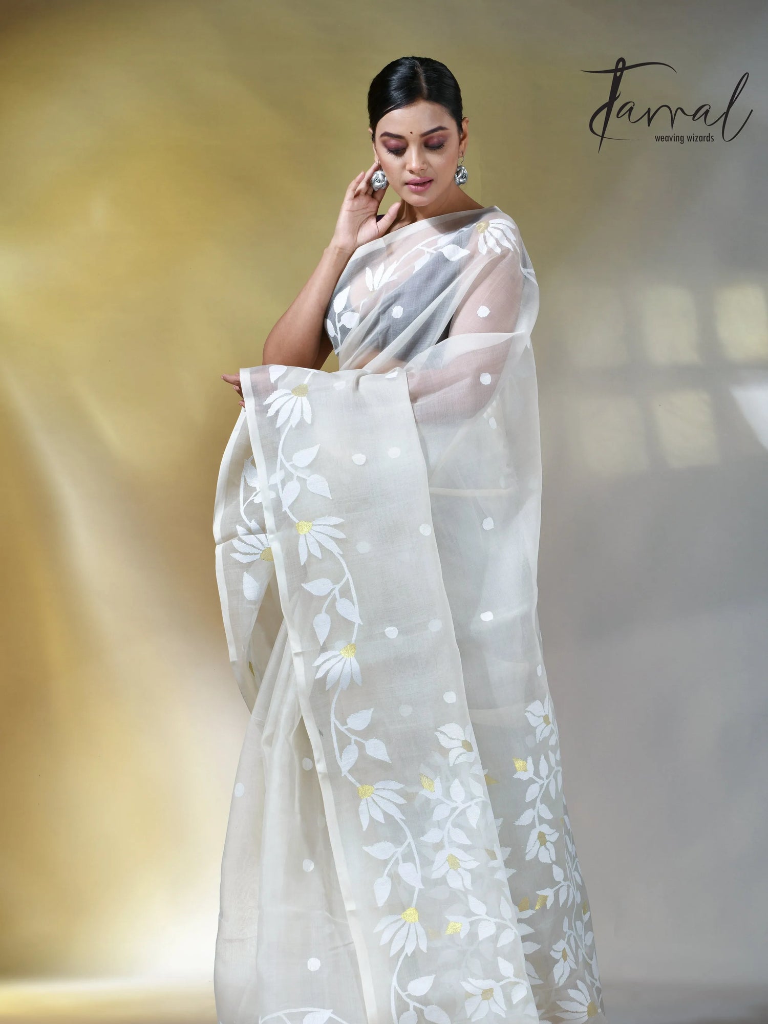 Off white self floral in handwoven muslin silk jamdani saree