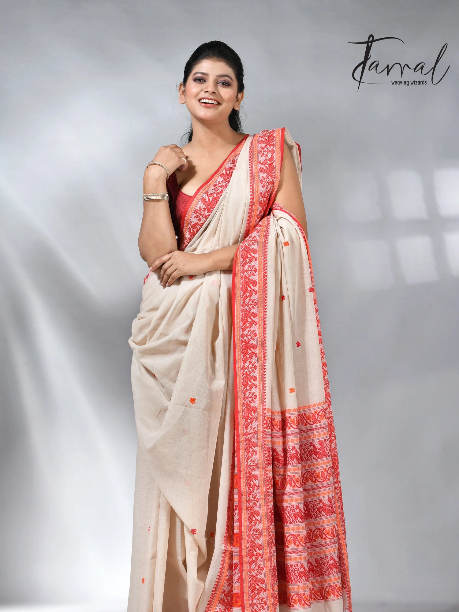 Offwhite with orange pure cotton baluchuri handloom saree