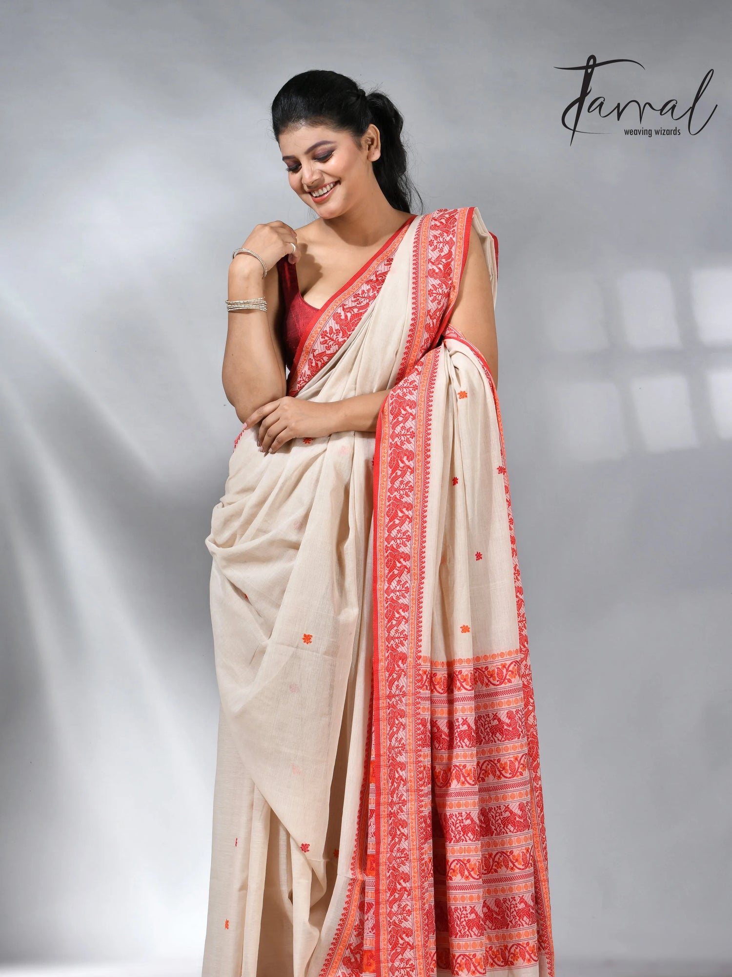 Offwhite with orange pure cotton baluchuri handloom saree