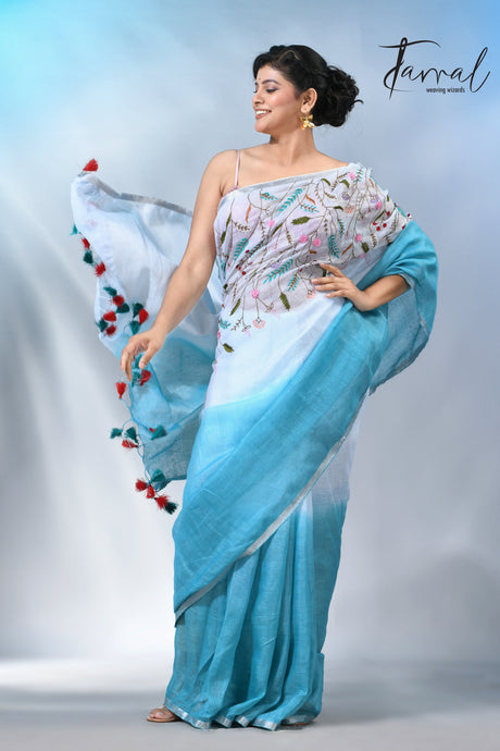 Offwhite with sky blue color pure linen hand embroidery saree