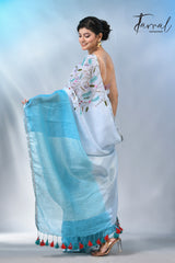 Offwhite with sky blue color pure linen hand embroidery saree