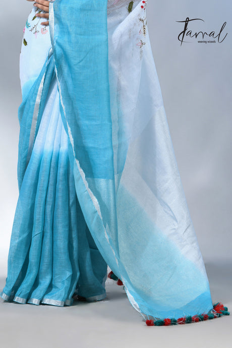 Offwhite with sky blue color pure linen hand embroidery saree