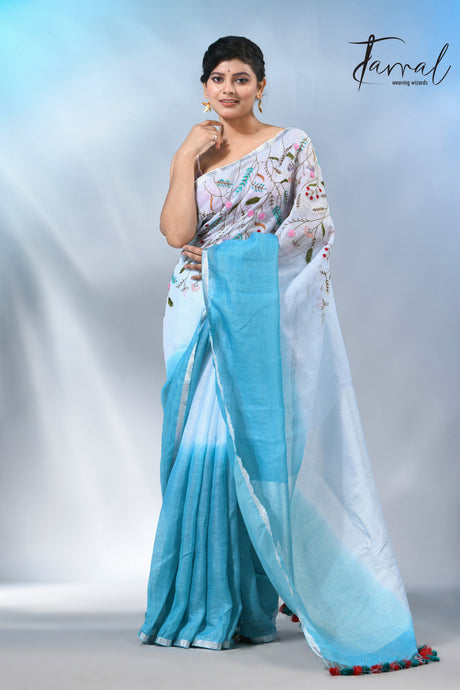 Offwhite with sky blue color pure linen hand embroidery saree