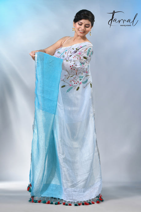 Offwhite with sky blue color pure linen hand embroidery saree