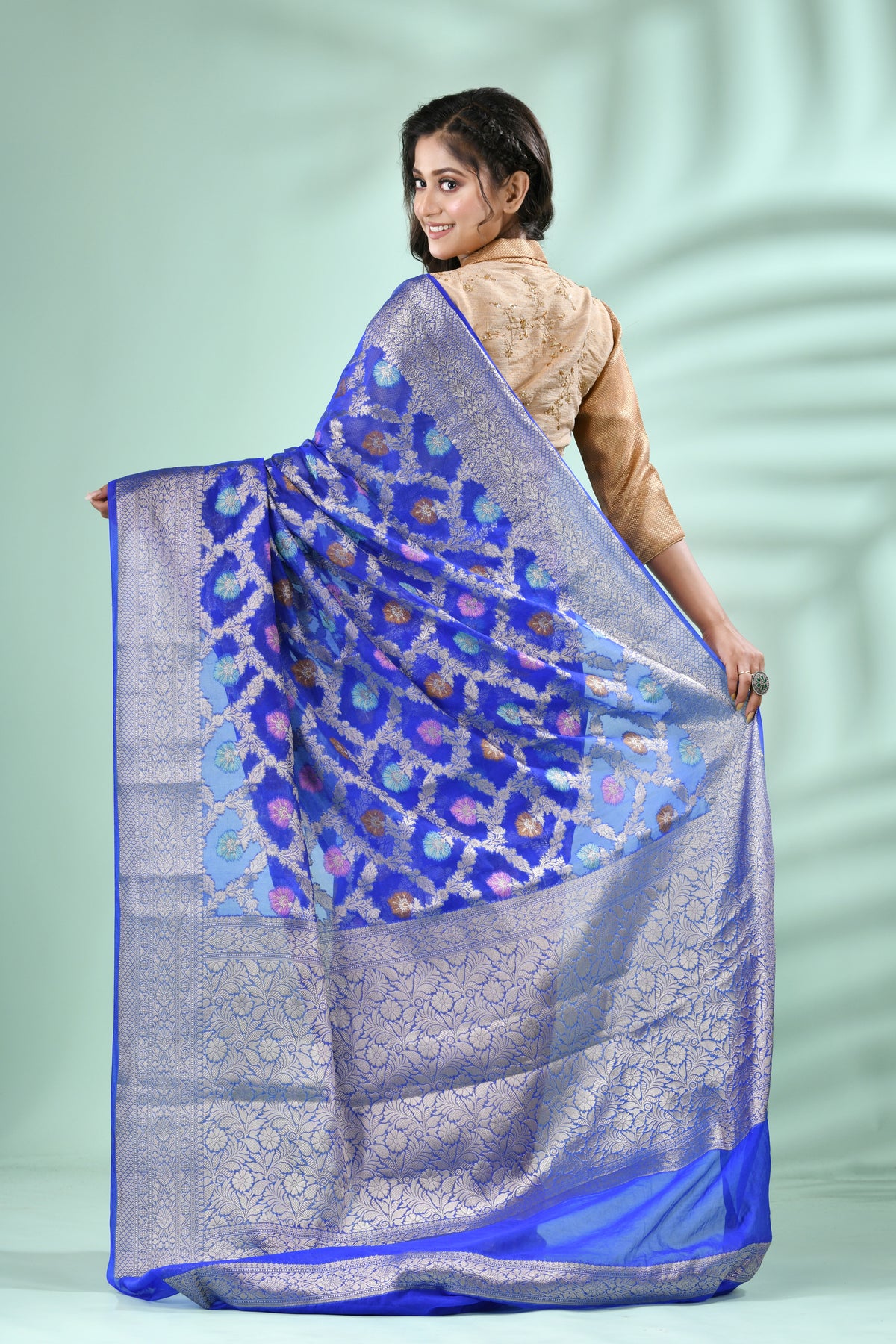 Royal Blue Banarasi Silk Saree with Antique Silver Zari Jal Weave, elegantly draped, showcasing intricate patterns and rich t