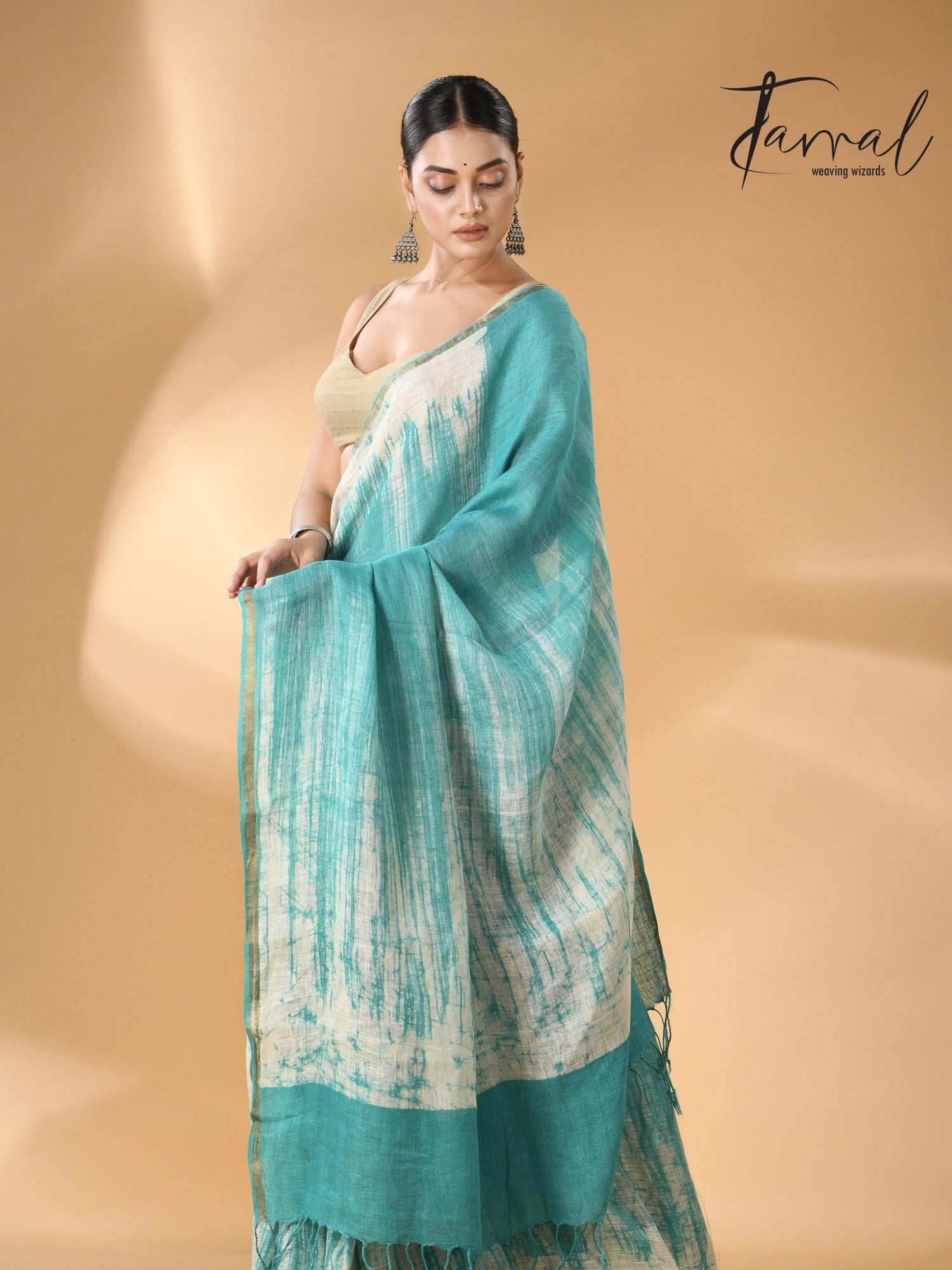 Sea green with white linen handcrafted batik saree left