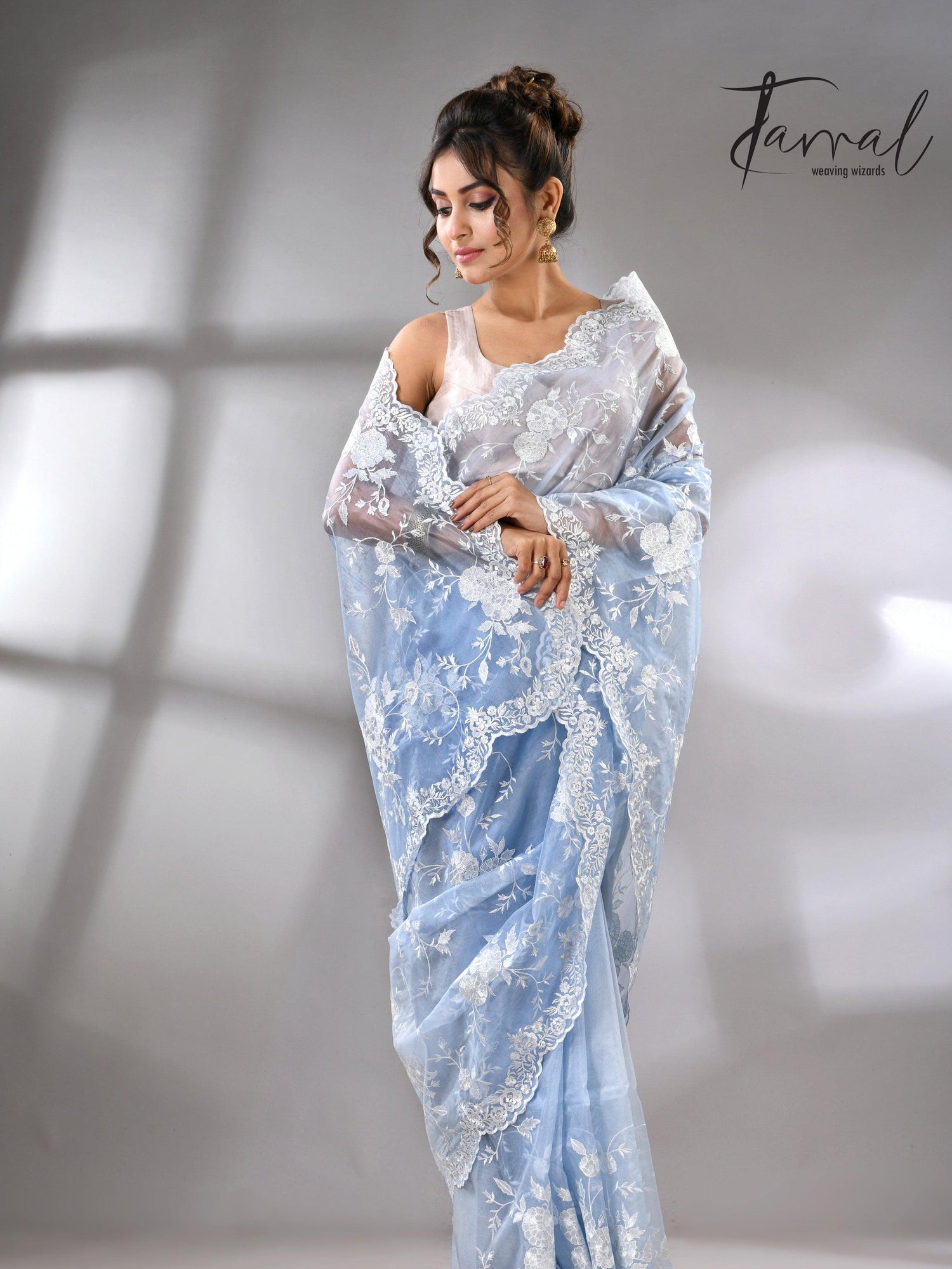 Sky blue organza embroidered handloom saree left