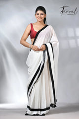 White with black colour border in mul cotton handloom saree