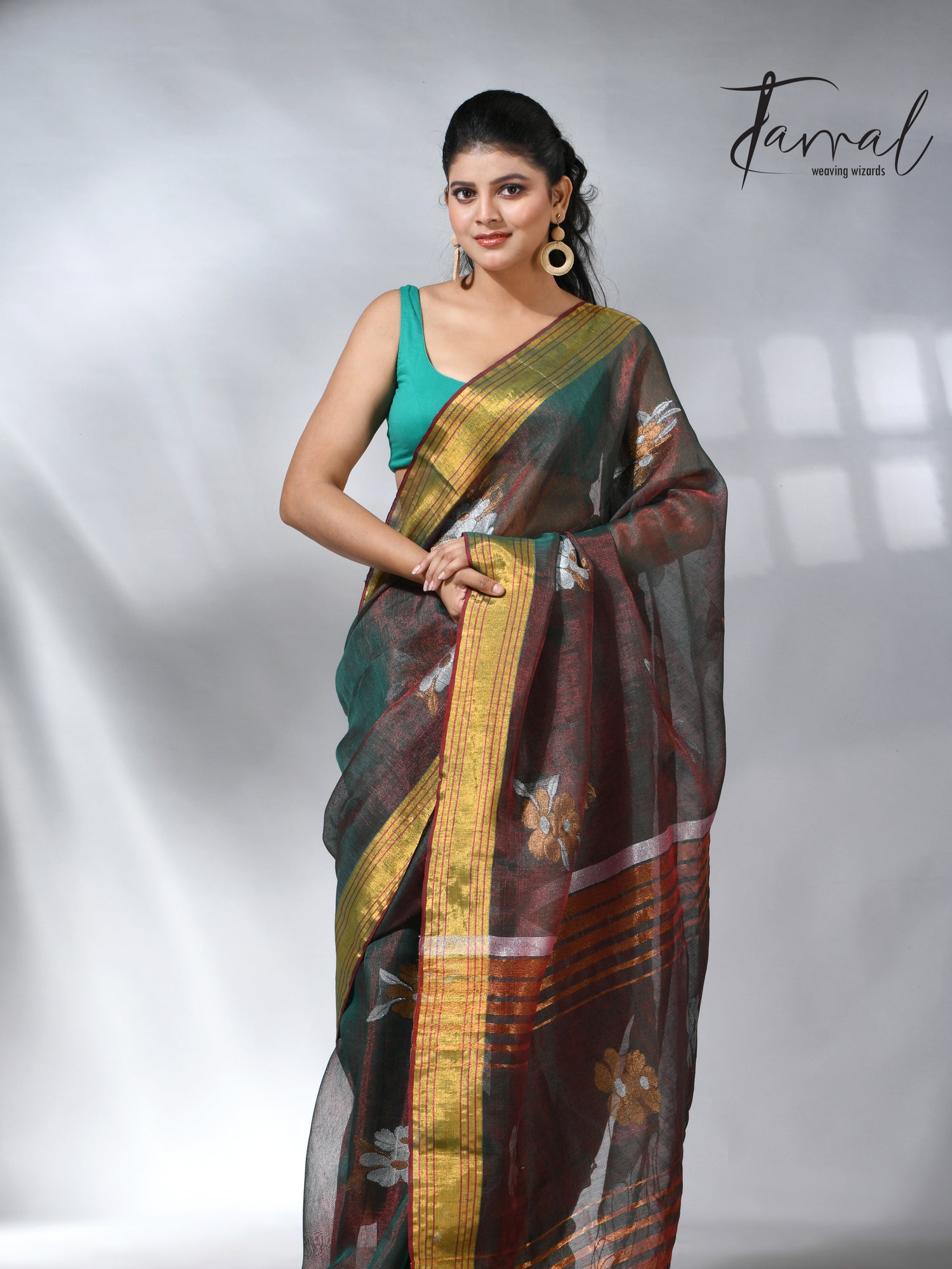 With this beautiful Pine green linen handloom jamdani saree