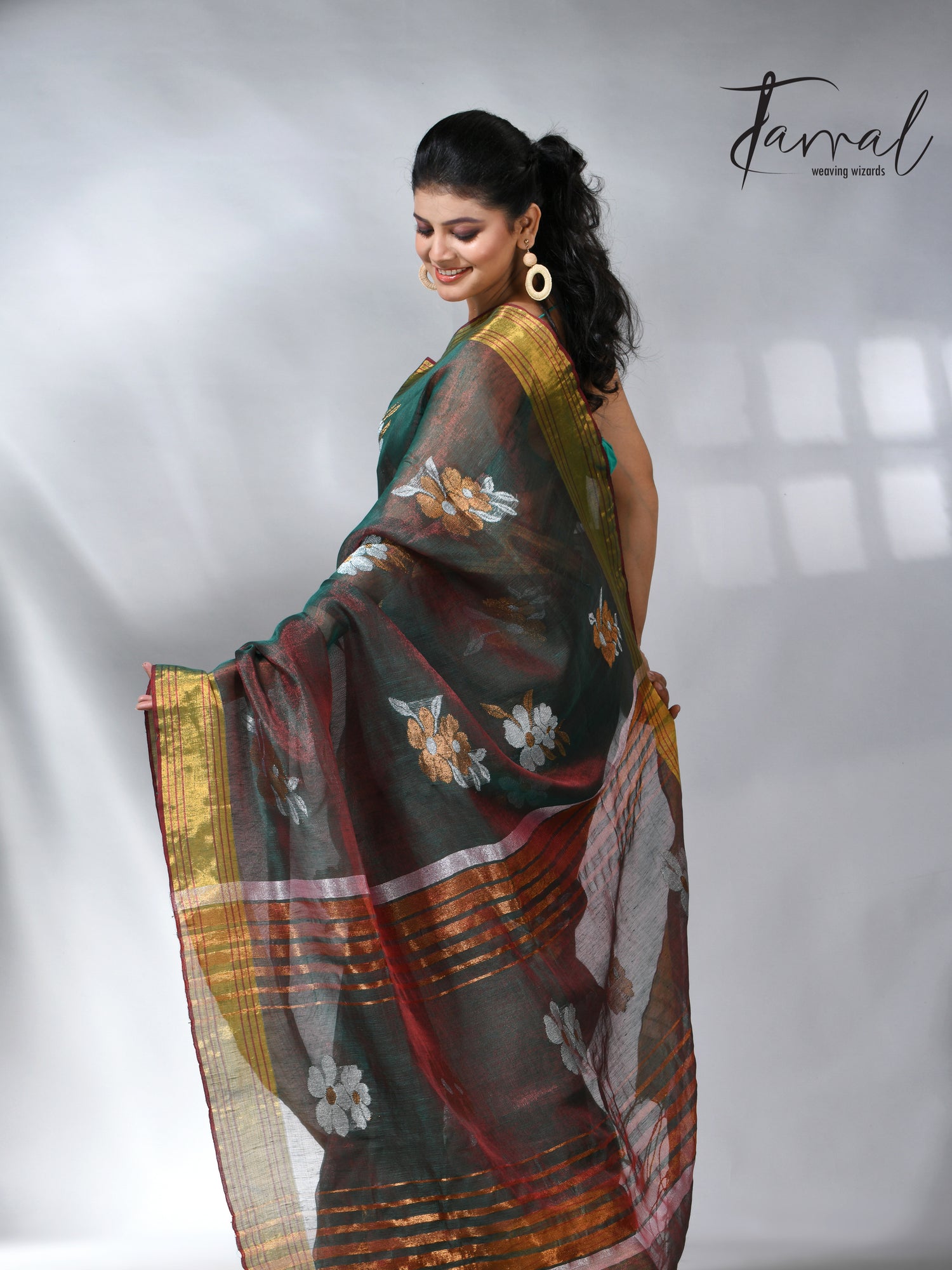 With this beautiful Pine green linen handloom jamdani saree