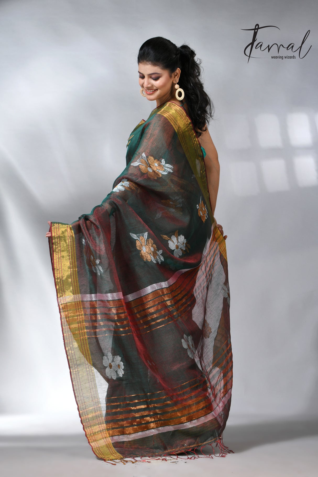 With this beautiful Pine green linen handloom jamdani saree