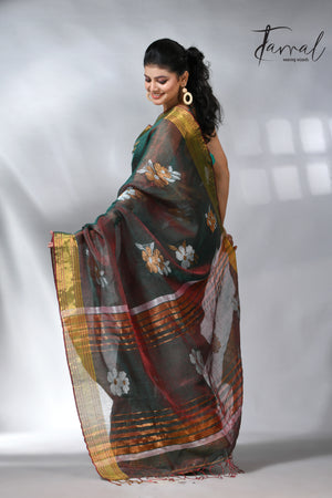 With this beautiful Pine green linen handloom jamdani saree