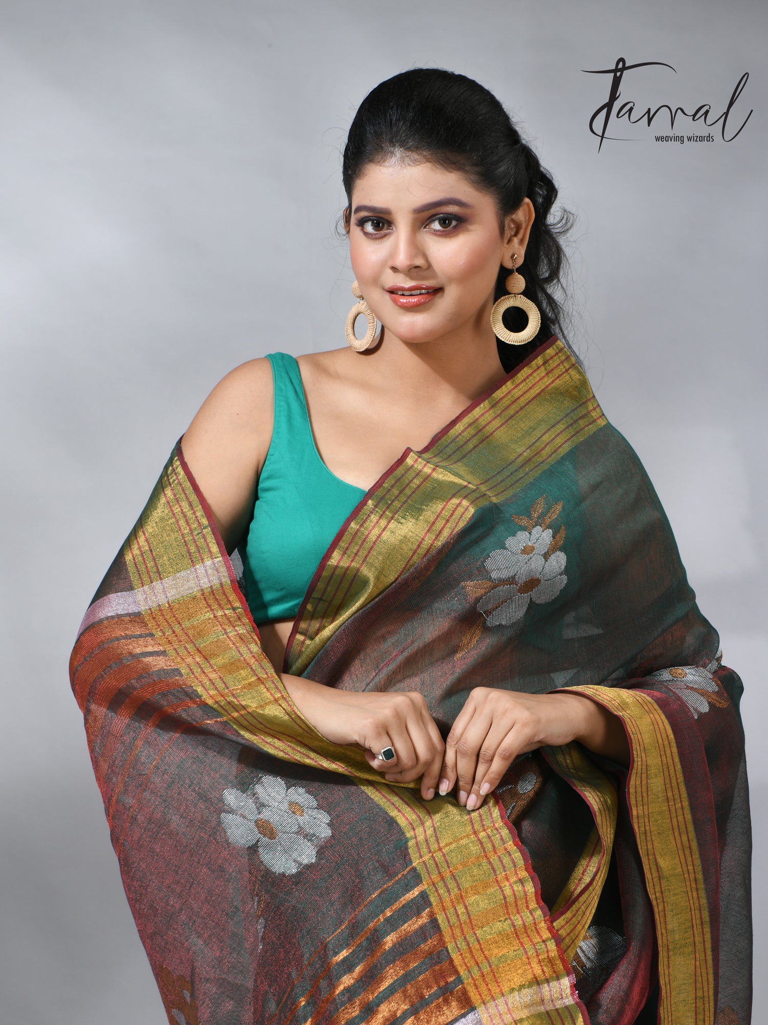 With this beautiful Pine green linen handloom jamdani saree
