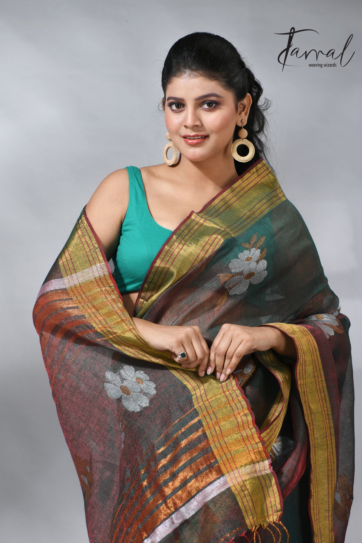 With this beautiful Pine green linen handloom jamdani saree