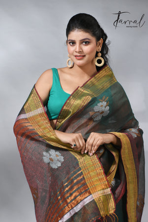 With this beautiful Pine green linen handloom jamdani saree