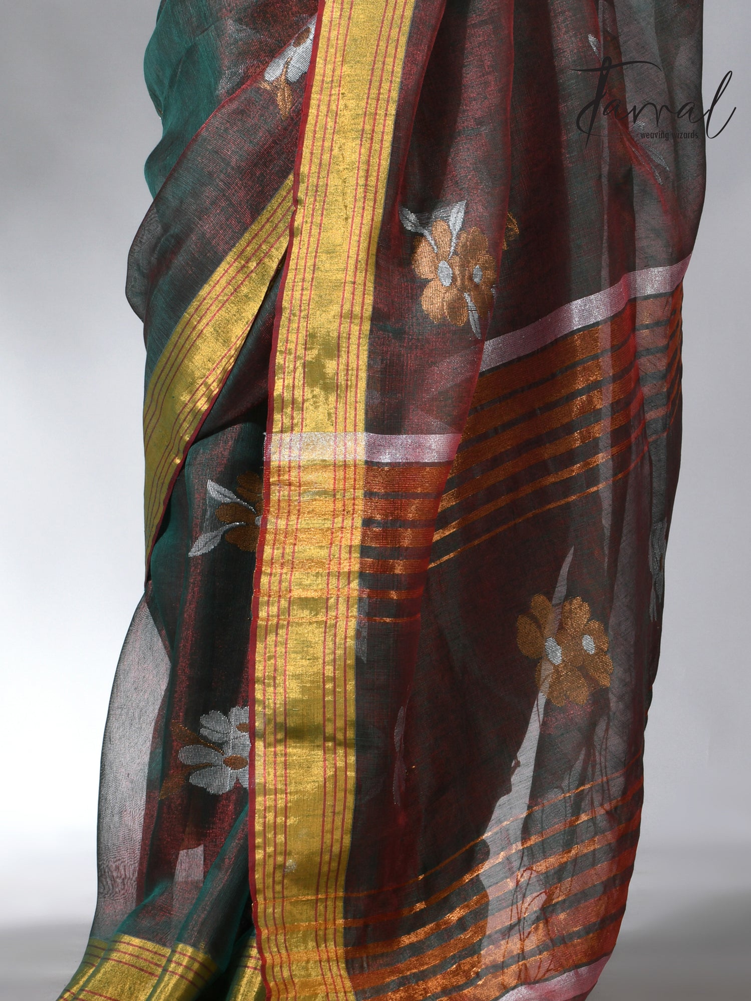 With this beautiful Pine green linen handloom jamdani saree
