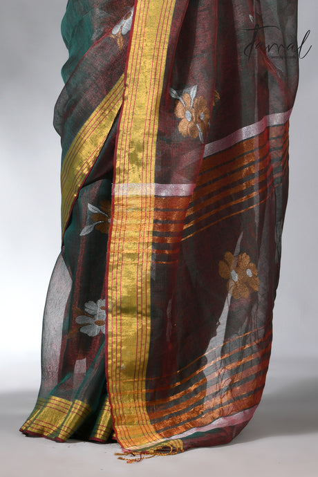 With this beautiful Pine green linen handloom jamdani saree