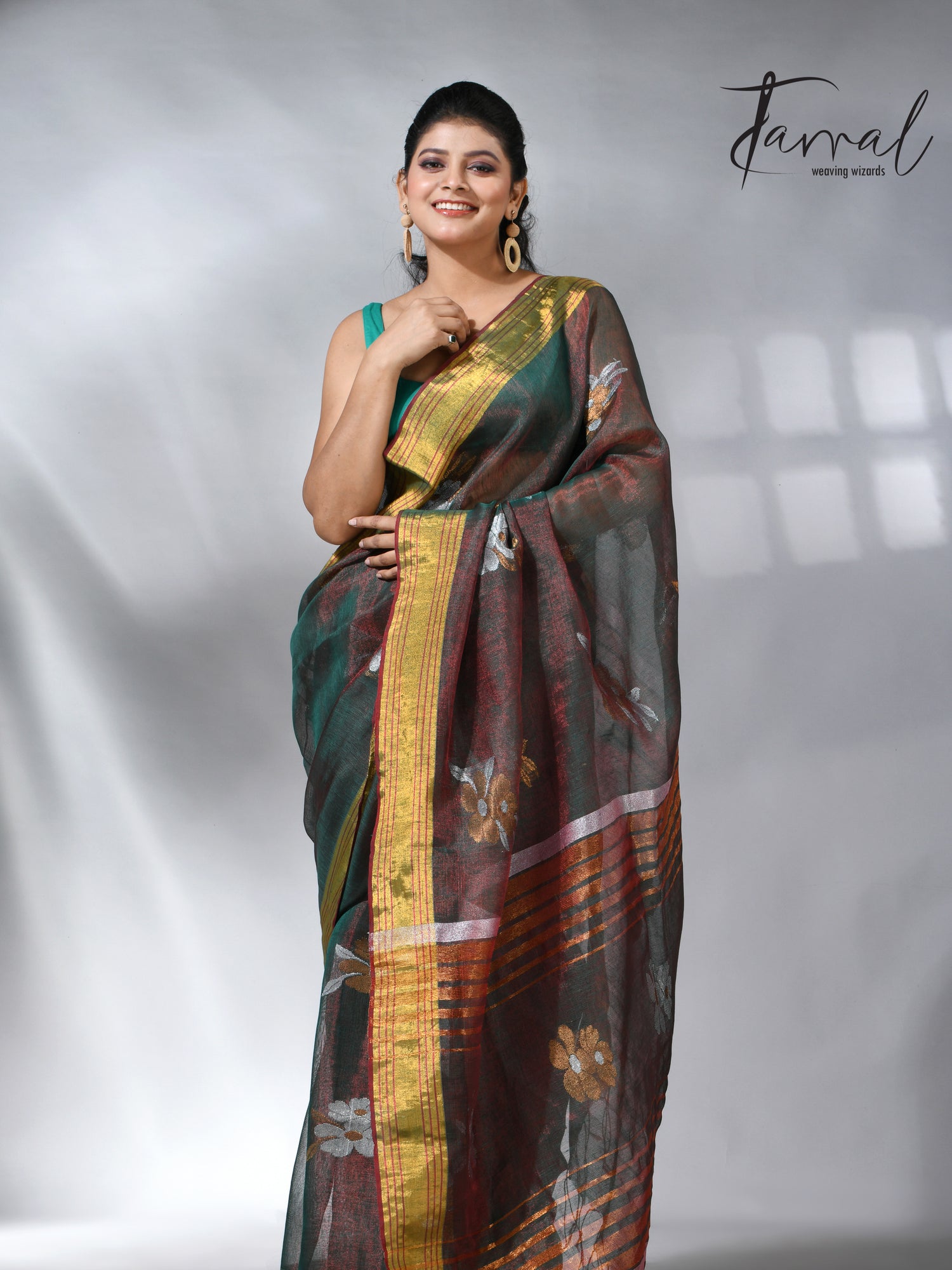 With this beautiful Pine green linen handloom jamdani saree