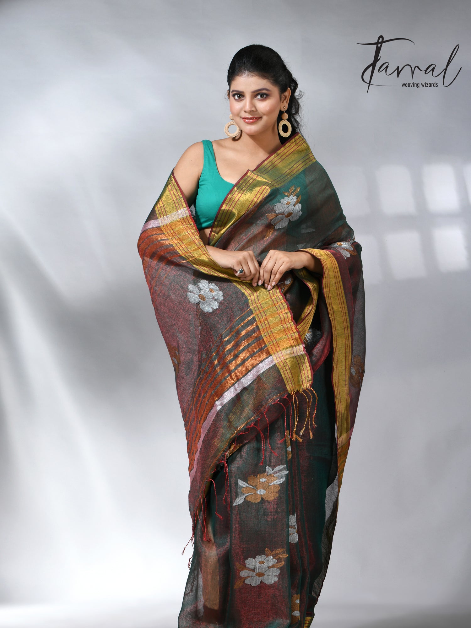 With this beautiful Pine green linen handloom jamdani saree