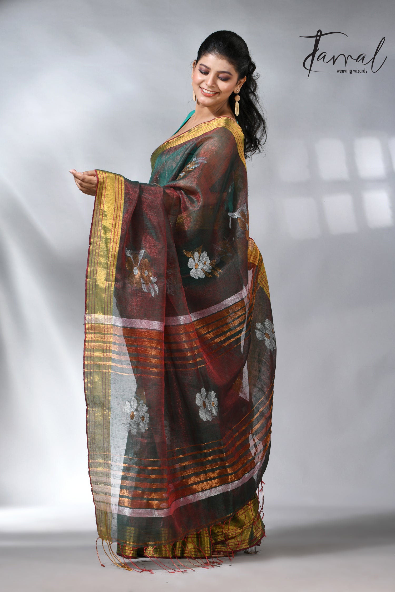 With this beautiful Pine green linen handloom jamdani saree