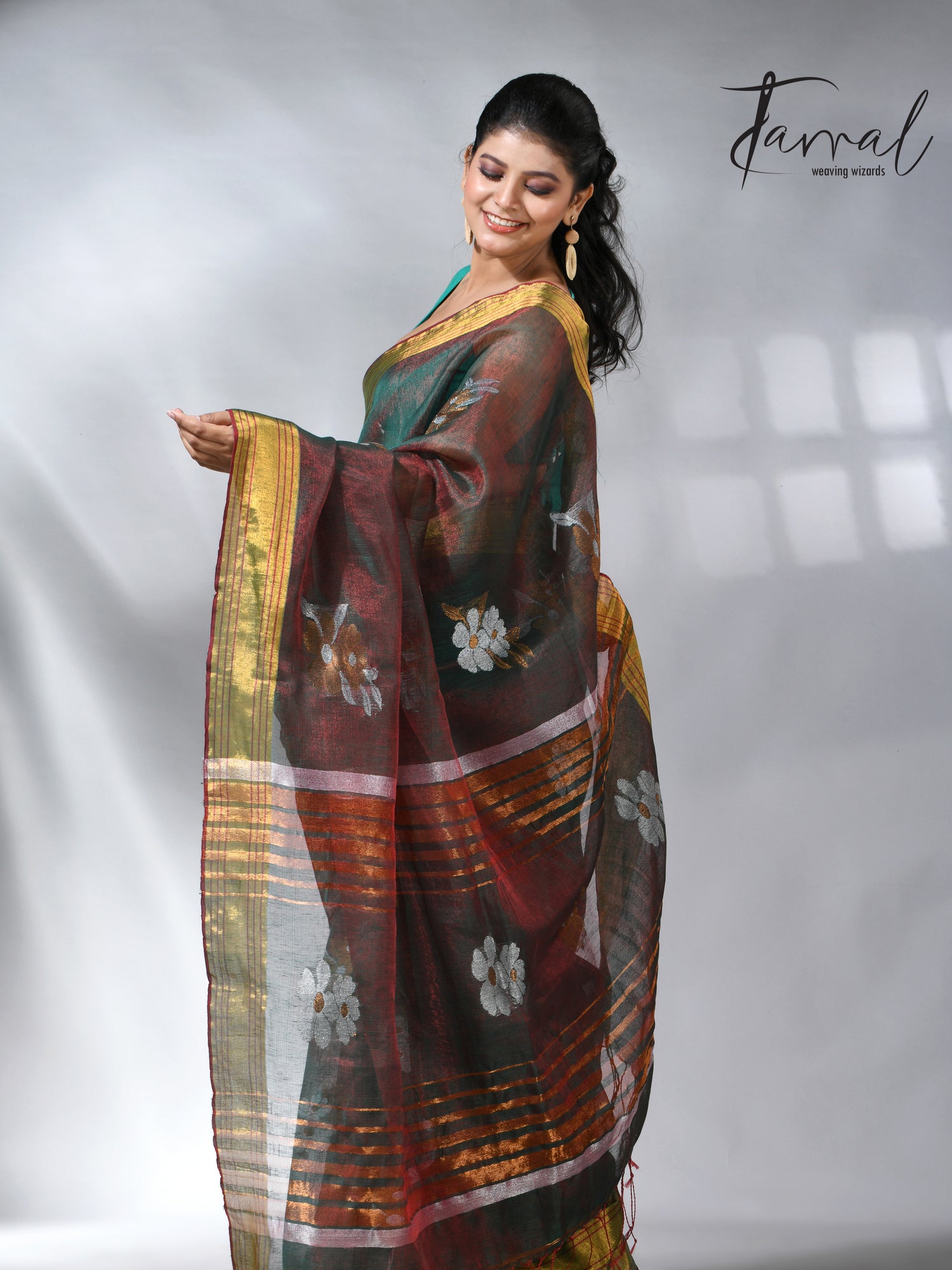 With this beautiful Pine green linen handloom jamdani saree