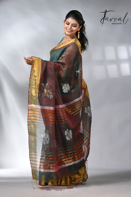 With this beautiful Pine green linen handloom jamdani saree